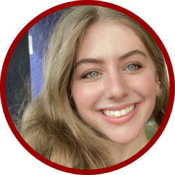 Headshot of a person with long hair and blue eyes, smiling warmly. The image is circular with a red border.